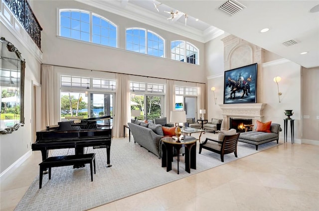 707 Grove Pl, Vero Beach, FL 32963 - tiled living room featuring a warm lit fireplace, ornamental molding, baseboards, and a high ceiling