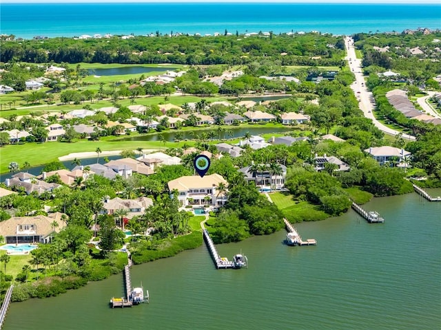 bird's eye view featuring a water view and a residential view