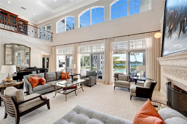 707 Grove Pl, Vero Beach, FL 32963 - carpeted living area featuring a high ceiling, healthy amount of natural light, a fireplace, ornamental molding, and coffered ceiling
