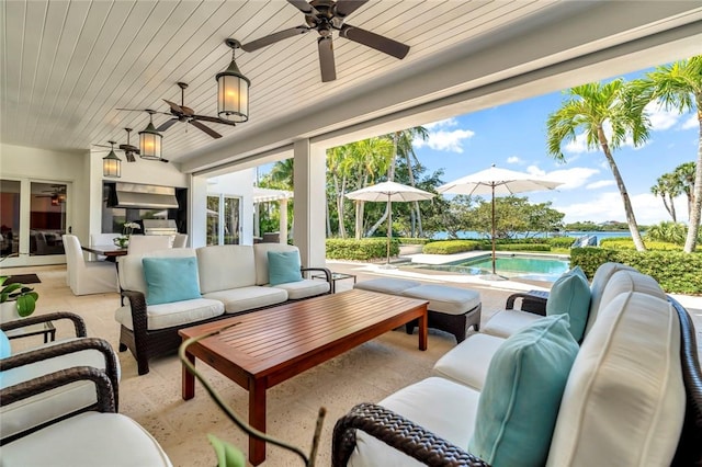 707 Grove Pl, Vero Beach, FL 32963 - view of patio with an outdoor hangout area, ceiling fan, an outdoor pool, and a water view