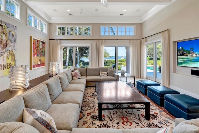 707 Grove Pl, Vero Beach, FL 32963 - living room with ornamental molding and a towering ceiling