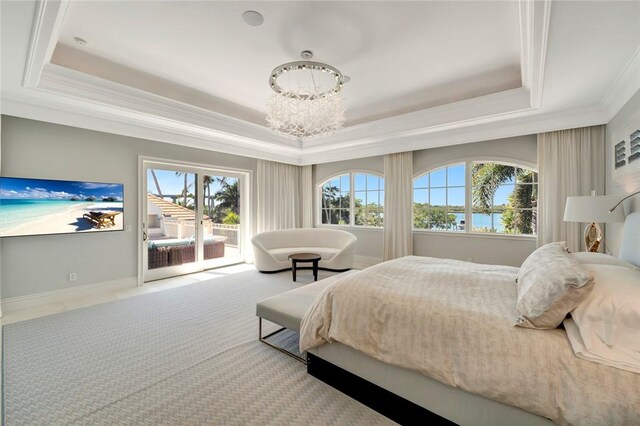707 Grove Pl, Vero Beach, FL 32963 - bedroom with a raised ceiling, crown molding, a chandelier, and access to outside