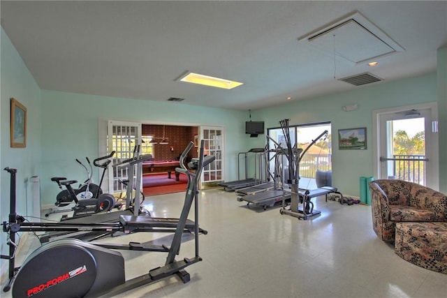 workout area with attic access, recessed lighting, and visible vents