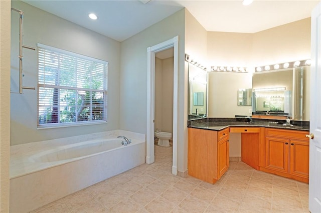 6124 57th Ct, Vero Beach, FL 32967 - bathroom featuring vanity, a bath, toilet, recessed lighting, and tile patterned floors