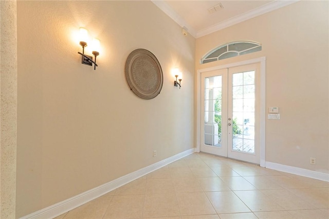 6124 57th Ct, Vero Beach, FL 32967 - foyer with french doors, ornamental molding, light tile patterned flooring, and baseboards