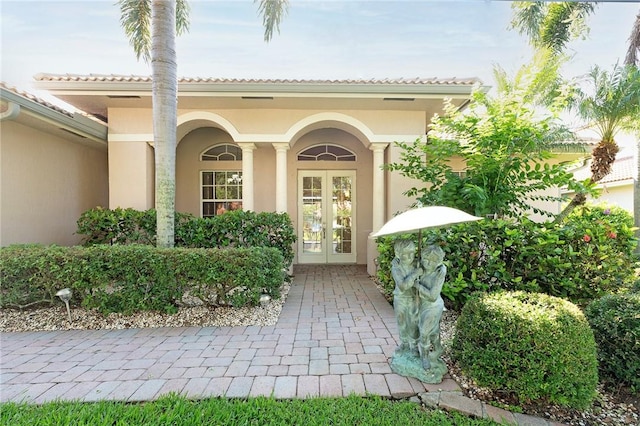6124 57th Ct, Vero Beach, FL 32967 - entrance to property featuring french doors and stucco siding
