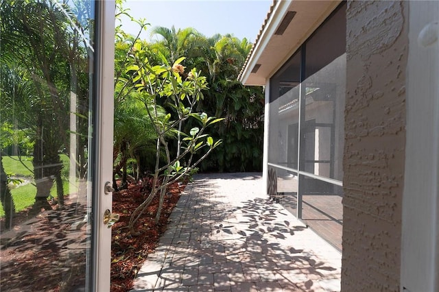 6124 57th Ct, Vero Beach, FL 32967 - view of patio with a sunroom