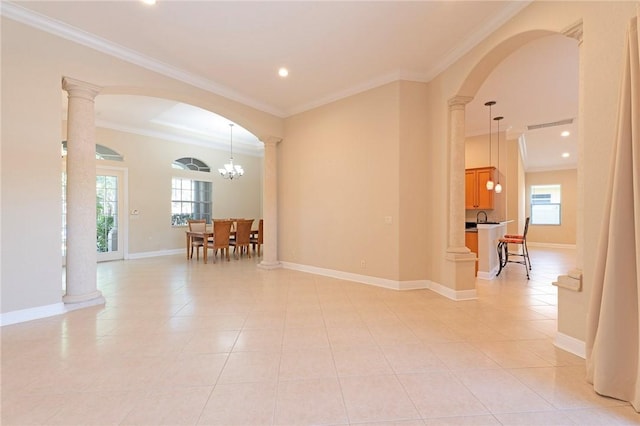 6124 57th Ct, Vero Beach, FL 32967 - empty room with arched walkways, crown molding, light tile patterned flooring, baseboards, and recessed lighting