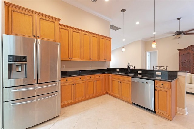 6124 57th Ct, Vero Beach, FL 32967 - kitchen featuring appliances with stainless steel finishes, a sink, ornamental molding, a peninsula, and decorative light fixtures