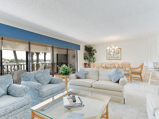 living room featuring a chandelier, a textured ceiling, and carpet flooring