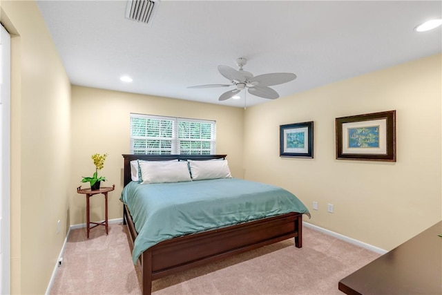 bedroom featuring ceiling fan and light carpet