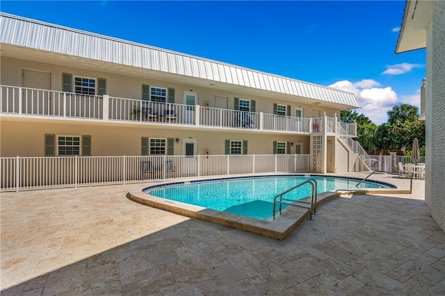 view of swimming pool with a patio area