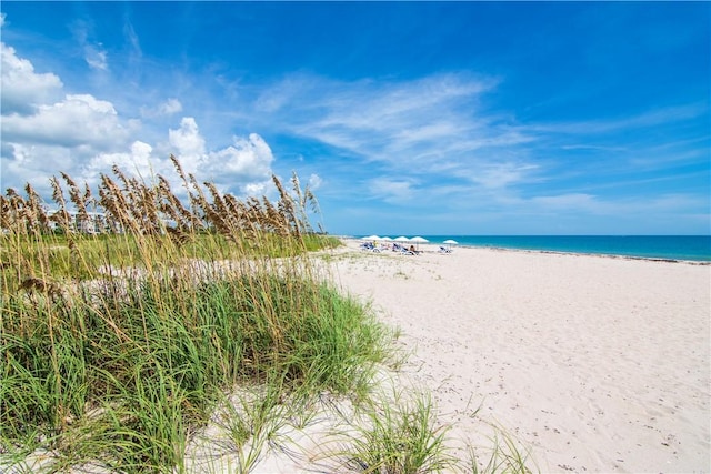 property view of water featuring a beach view