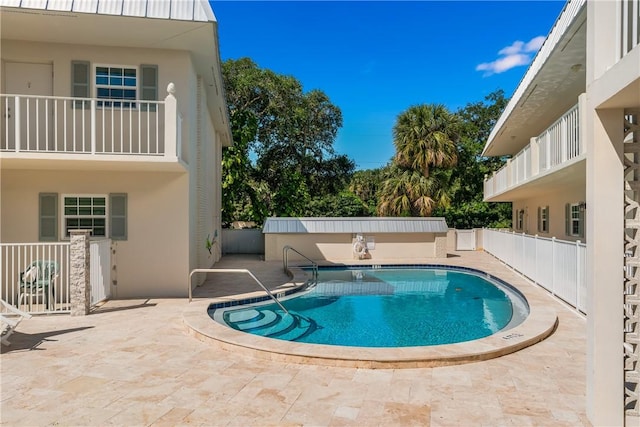 view of pool featuring a patio area