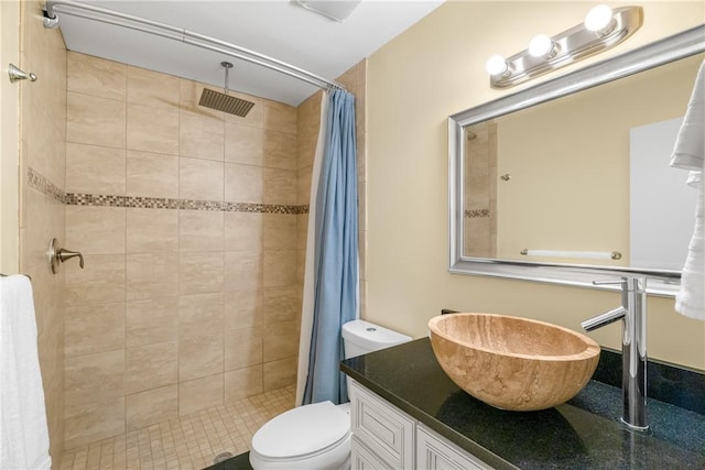 bathroom featuring a shower with curtain, vanity, and toilet