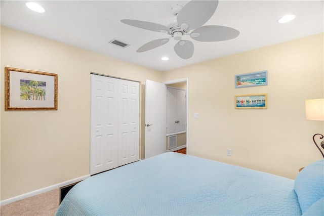 bedroom with ceiling fan, a closet, and carpet