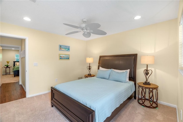 carpeted bedroom featuring ceiling fan