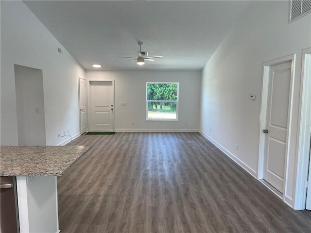 unfurnished living room with dark hardwood / wood-style floors and ceiling fan