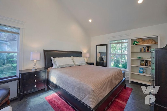 bedroom with high vaulted ceiling and recessed lighting