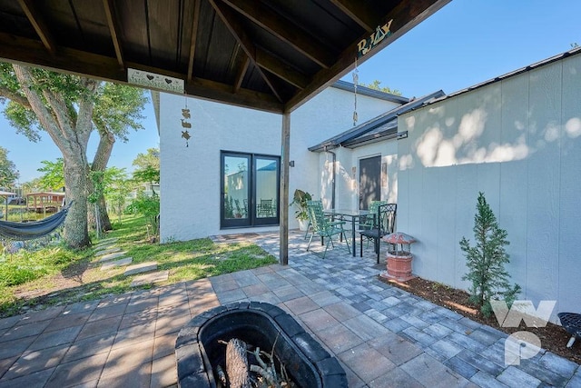 view of patio / terrace with a fire pit