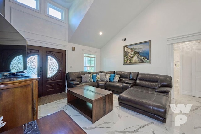 living area with marble finish floor, french doors, recessed lighting, visible vents, and high vaulted ceiling