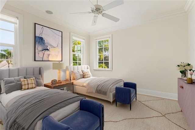 bedroom with ornamental molding and ceiling fan