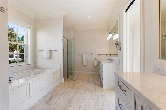 bathroom with crown molding, vanity, and separate shower and tub