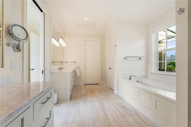 bathroom featuring ornamental molding, tiled bath, and vanity