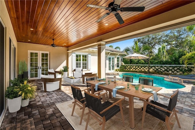 view of patio / terrace with ceiling fan and french doors