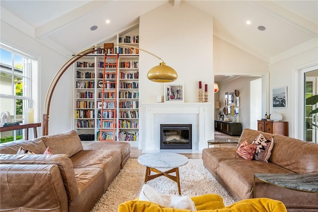 living room with wood-type flooring, high vaulted ceiling, and beamed ceiling