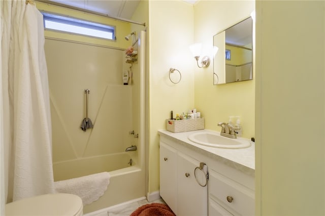 full bathroom featuring tile patterned floors, vanity, toilet, and shower / tub combo