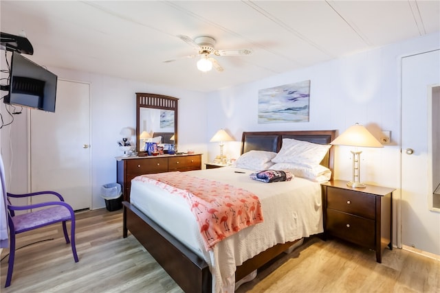 bedroom featuring hardwood / wood-style flooring and ceiling fan