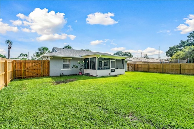 5845 23rd St, Vero Beach, FL 32966 - rear view of house featuring stucco siding and a sunroom