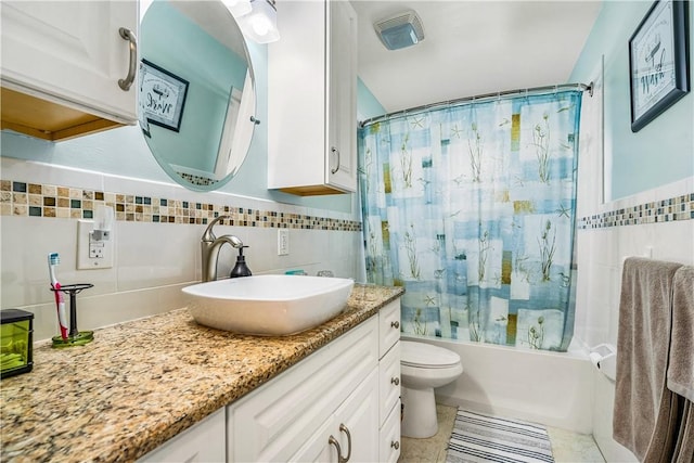 5845 23rd St, Vero Beach, FL 32966 - bathroom featuring tile walls, vanity, toilet, shower / bath combo, and decorative backsplash