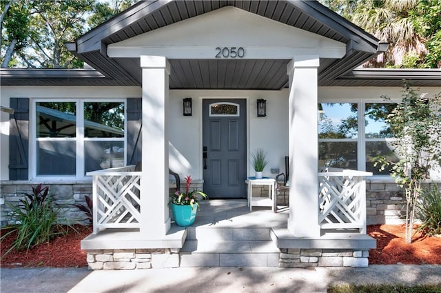 entrance to property with covered porch