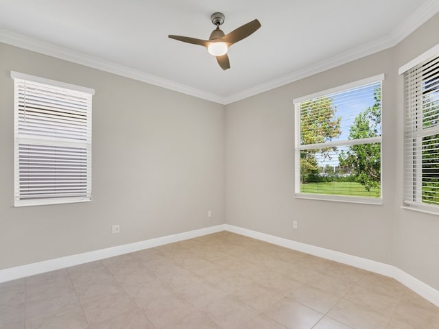 spare room with ceiling fan, a wealth of natural light, and ornamental molding