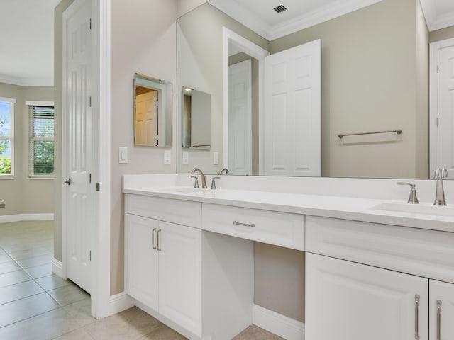 bathroom featuring vanity, tile patterned flooring, and crown molding