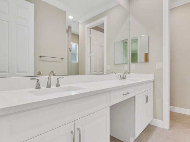 bathroom with vanity, tile patterned flooring, and ornamental molding