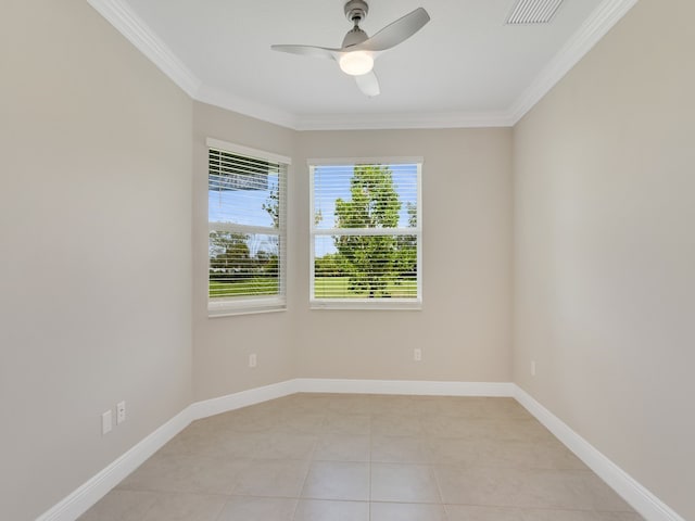 tiled empty room with ceiling fan and ornamental molding