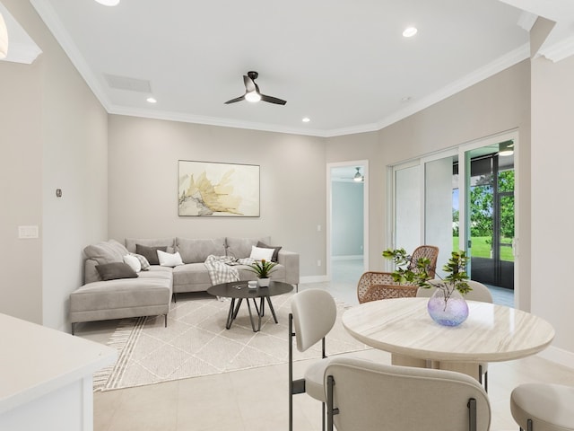 tiled dining area featuring ornamental molding and ceiling fan