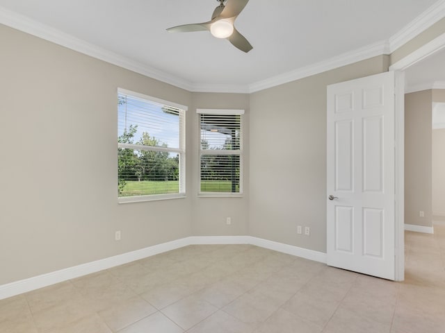 empty room with ornamental molding, ceiling fan, and light tile patterned floors