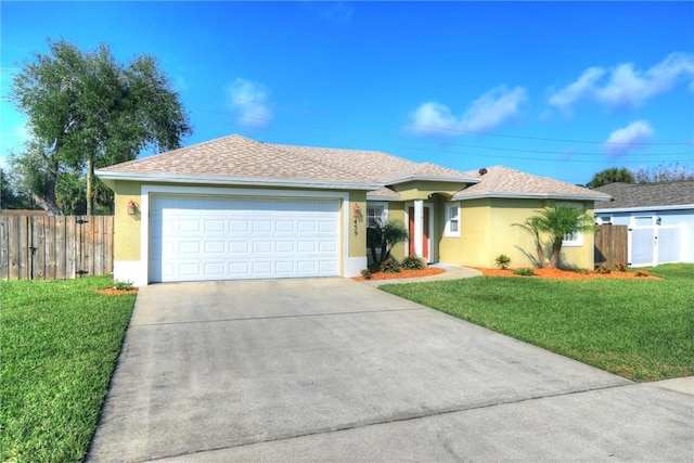 ranch-style house with a garage and a front lawn