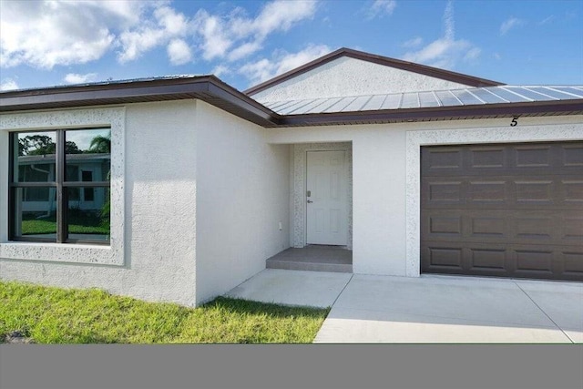 entrance to property featuring a garage