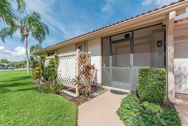 property entrance featuring a yard