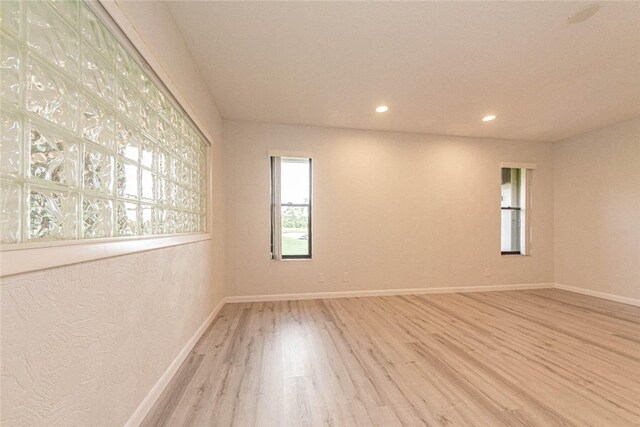 spare room with light wood-type flooring