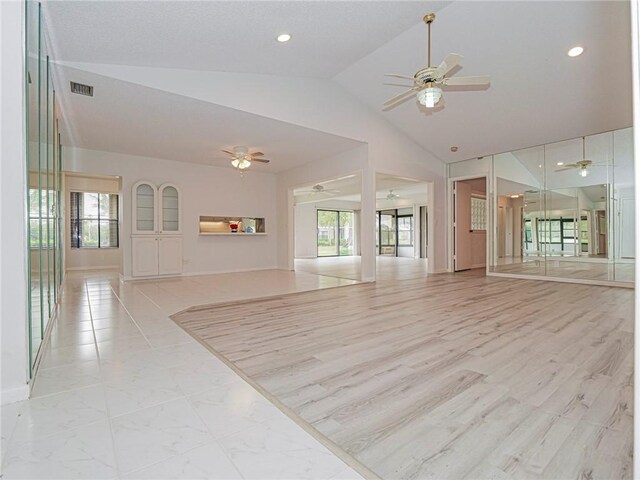 unfurnished living room with light hardwood / wood-style flooring and ceiling fan