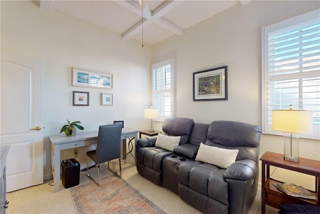 office area featuring light colored carpet and beam ceiling