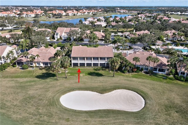 birds eye view of property featuring a residential view, a water view, and golf course view