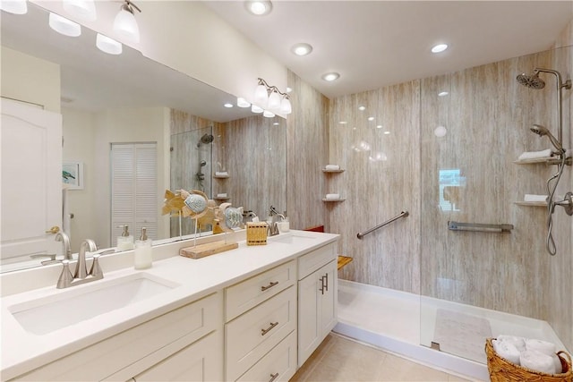 bathroom with vanity, tile patterned floors, and a shower