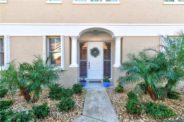 4853 N Newport Island Dr Unit 12B, Vero Beach, FL 32967 - view of exterior entry featuring stucco siding